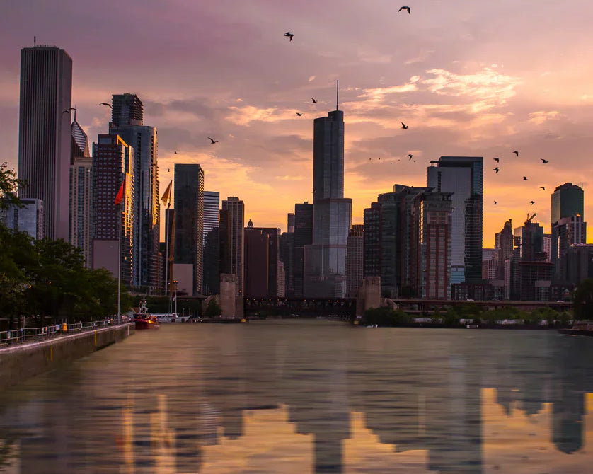 Chicago skyline reflected on Lake Michigan at golden hour during a Wendella sunset cruis